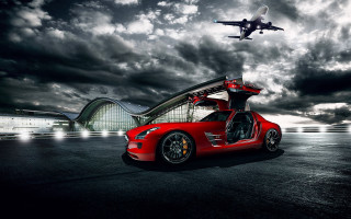 Red sportscar jet plane cloudy - overhead in the sky above free wallpaper for desktop