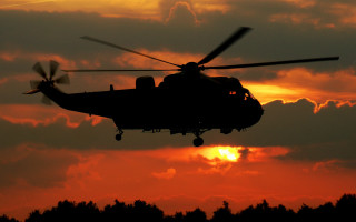 Helicopter sunset clouds bird fire - a helicopter free wallpaper