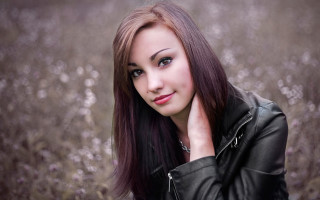 Woman longhair leatherjacket flowerfield portrait - a picture in a field of flowers free wallpaper