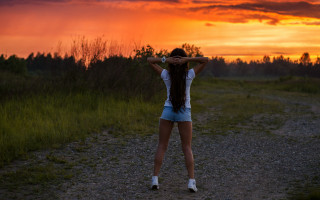 Woman back sunset hair air - the sun setting behind her free wallpaper