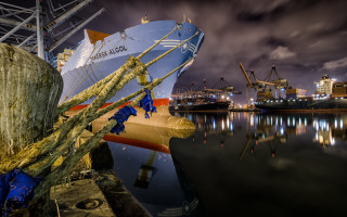 Large boat docked cloudy sky - a large boat free wallpaper