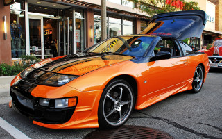 Car parked open road storefront - a car in the background free wallpaper