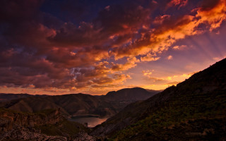 Sunset mountain lake clouds autumn - a sunset view of a mountain range free wallpaper