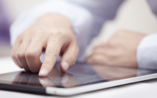 Touching tablet hands blurry background - the keyboard free wallpaper