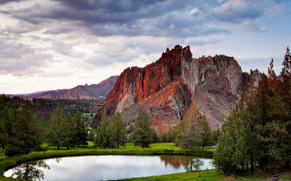 Mountain lake forest cloudy sky 3 - a lake in the foreground and a forest in the background free wallpaper for desktop