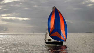Sailboat blue orange sail cloudy - kodachrome free wallpaper