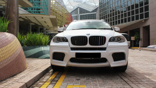 White car building brick road - neoism free wallpaper