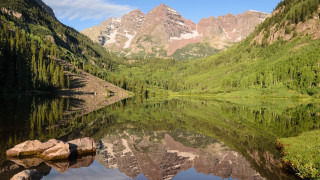 Mountain lake forest bridge sky 4 - the foreground and a mountain range in the background free wallpaper for desktop