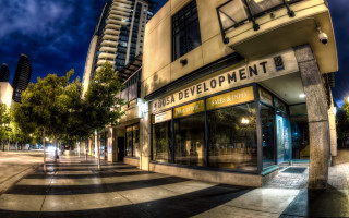 Street corner building trees night - modern art deco free wallpaper