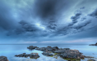 Stormy cloudy sky rocky shore - a few rock free wallpaper