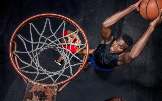 Man dunking basketball from above - a basketball free wallpaper