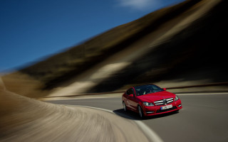 Red car mountain road blue - motion blur free wallpaper