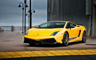 Yellow sports car street building 4 - a yellow sports car free wallpaper