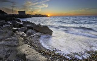Sunset ocean rocky shore city - digital photography free wallpaper