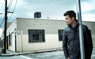 Man street sign clock tower - front of a building free wallpaper