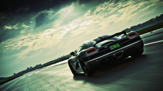 Sports car road cloudy sky - a sports car free wallpaper