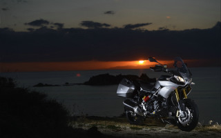 Motorcycle hill ocean sunset clouds - a motorcycle free wallpaper