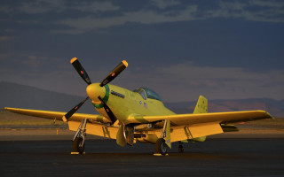 Yellow airplane runway mountains dusk - a dark sky free wallpaper