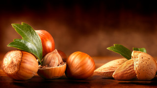 Nuts leaves table brown background - a table top next free wallpaper