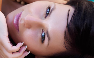 Blue eyed woman laying portrait - anna haifisch free wallpaper