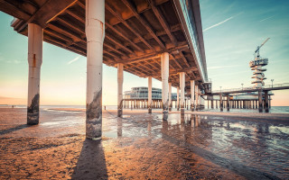 Pier building sunset waterwaves cityscape - a few wave free wallpaper