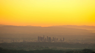 City skyline mountains dusk hazy - free city wallpaper