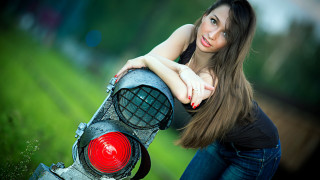 Woman leaning trafficlight grass field - a green field free wallpaper for desktop