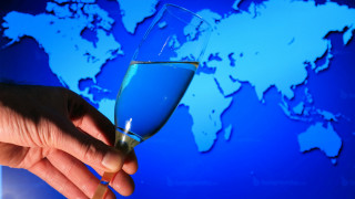 Hand glass blue liquid world - a hand holding free wallpaper