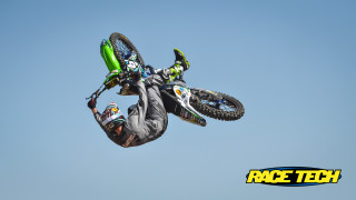 Man flying motorcycle air helmet - action pose free wallpaper