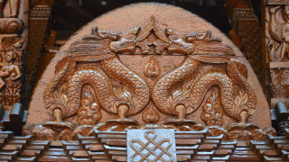 Carved wooden dragon cross arkhip - an art deco sculpture free wallpaper
