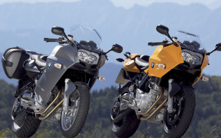 Motorcycles grass trees mountains outdoor - a field of grass and trees free wallpaper