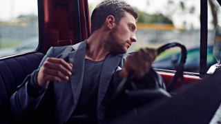 Man sitting bus smoking looking - a bus free wallpaper