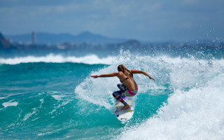 Woman surfing ocean city sky - a woman riding free wallpaper