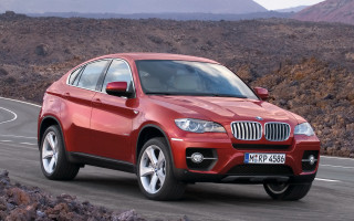Red bmw suv desert mountains - a road in the desert free wallpaper