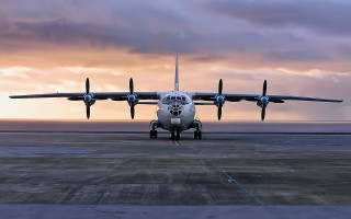 Large airplane runway sunset clouds - a large airplane free wallpaper