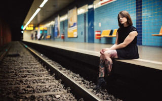 Woman sitting train track portrait - underground comix free wallpaper