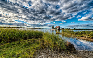House island lake cloudy sky - a small island in the middle of a lake free wallpaper