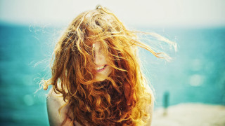 Woman red hair beach ocean - long red hair free wallpaper