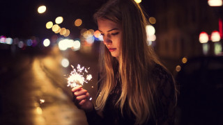 Woman sparkler night street christmas - a sparkler free wallpaper