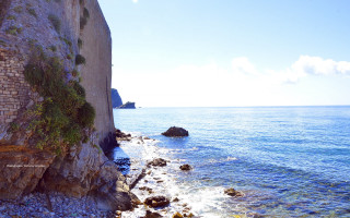 Rocky cliff water mountain sky 2 - a cliff face free wallpaper