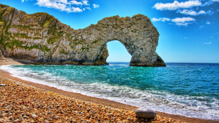 Rock arch beach water mountain - a rock formation free wallpaper
