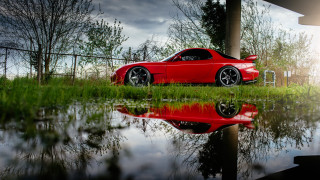 Red sports car fence puddles - a red sports car free wallpaper
