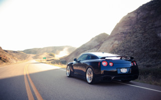 Black sports car mountain road 6 - a black sports car free wallpaper