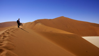 Man dog desert mountains sand - a desert landscape free wallpaper for desktop