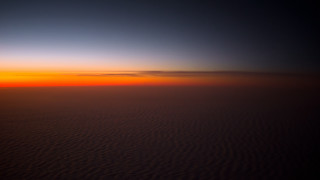 Sunset plane wing dim lighting - an airplane window free wallpaper