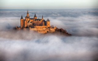 Castle foggy sky trees mountains - a foggy sky free wallpaper