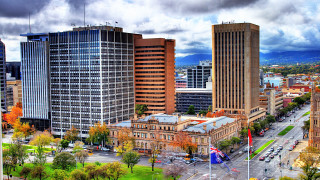 City skyline tower bridge river - a green field in the foreground free wallpaper