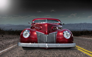 Red classic car desert mountains - a red classic car free wallpaper