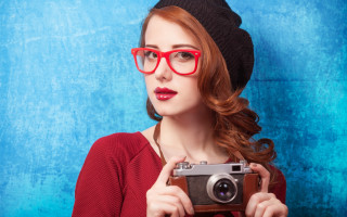 Woman glasses hat camera blue - a camera in front free wallpaper