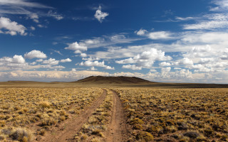 Desert dirt road mountain clouds - landscape free wallpaper